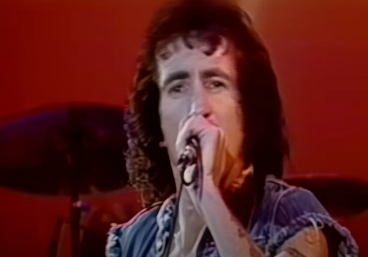 Screenshot of Bonn Scott performing on stage from - AC/DC: The Bon Scott Years (2005)