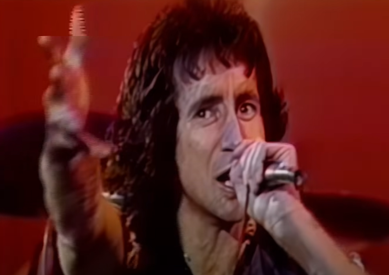 Screenshot of Bonn Scott performing on stage from - AC/DC: The Bon Scott Years (2005)