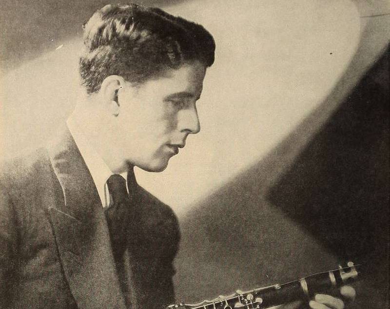 A portrait of Rudy Vallee playing an instrument