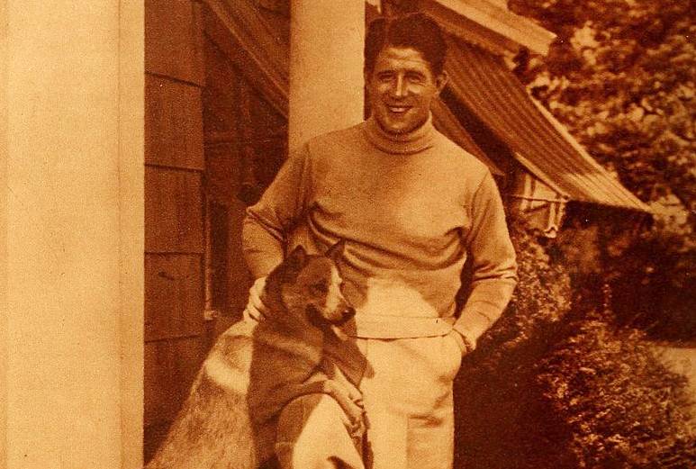 A portrait of Rudy Vallee with his dog