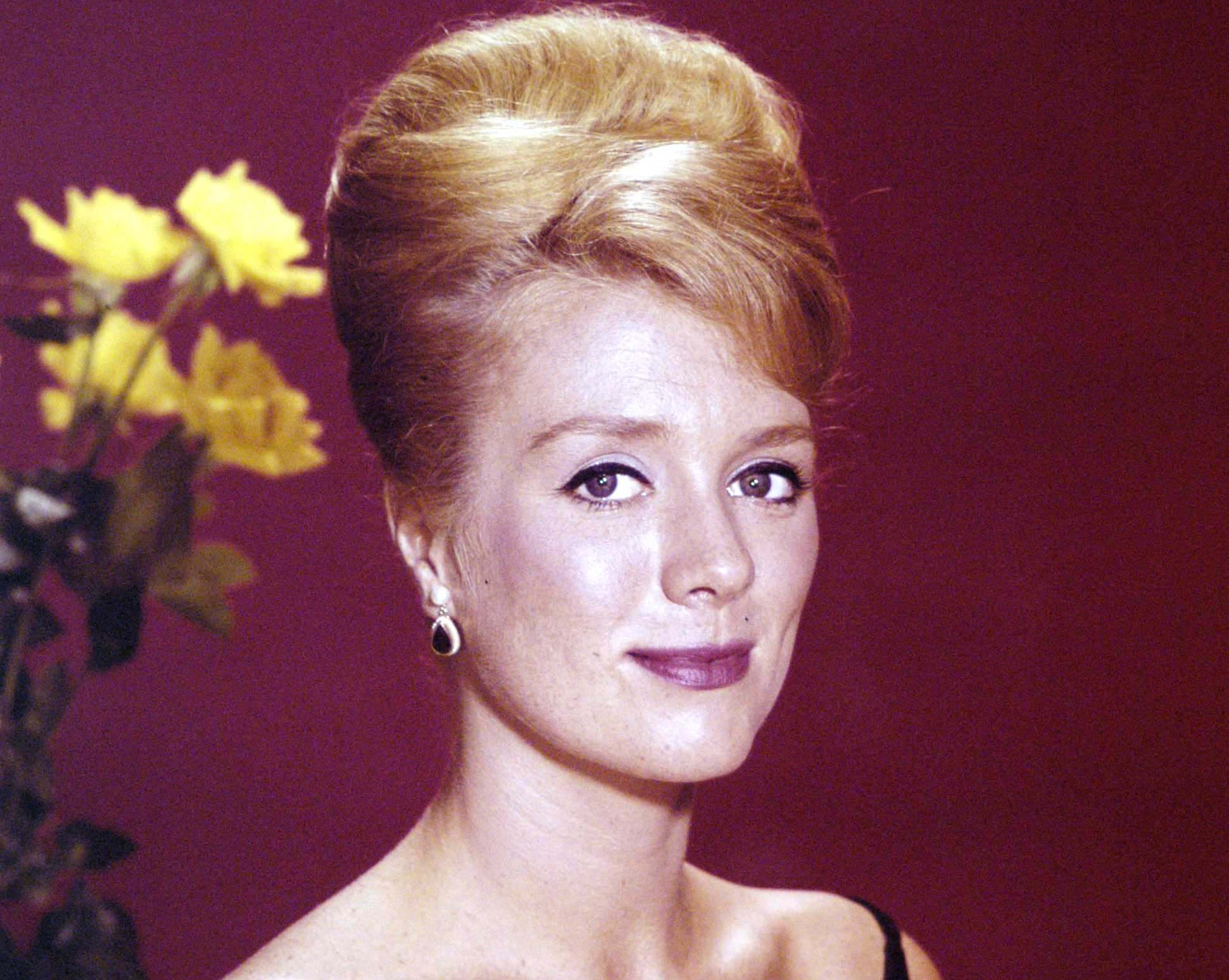 Inger Stevens portrait in black dress and earrings