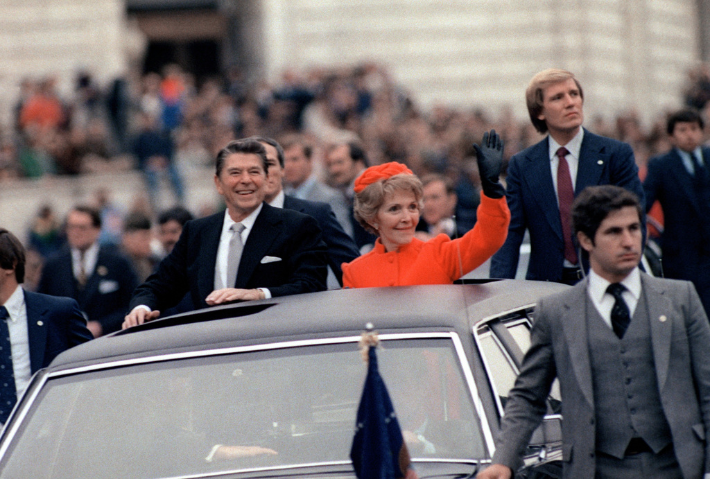 President Ronald W. Reagan and his wife, Nancy, wave to the public