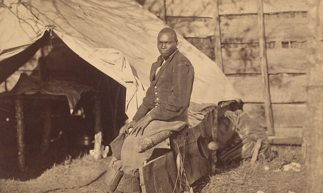 Black Soldier in Camp