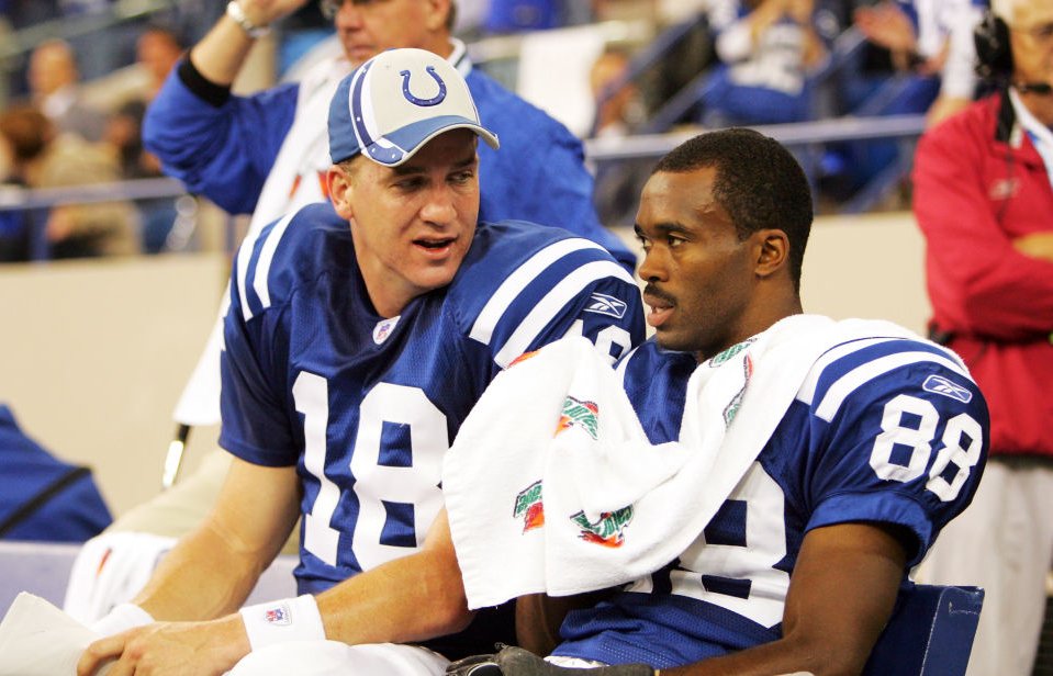 Peyton Manning #18 and Marvin Harrison #88 of the Indianapolis Colts talk on the bench