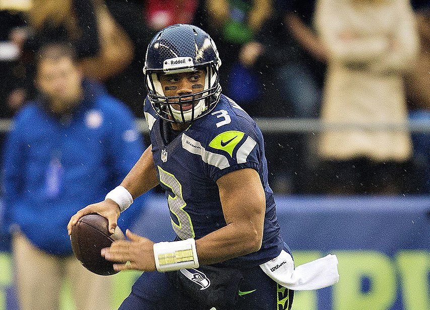 Russell Wilson holding football