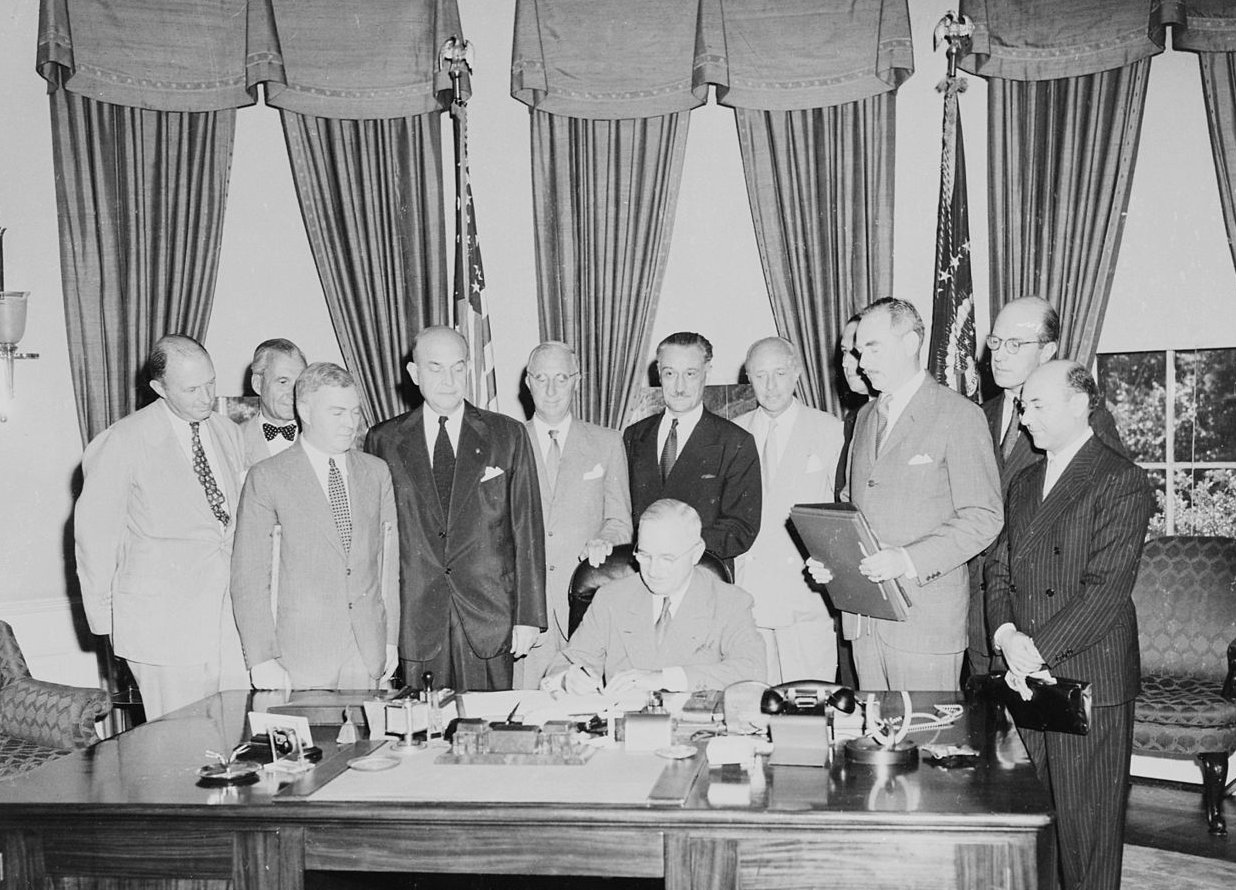 Photograph Of President Truman Signing The Document Implementing The North Atlantic Treaty