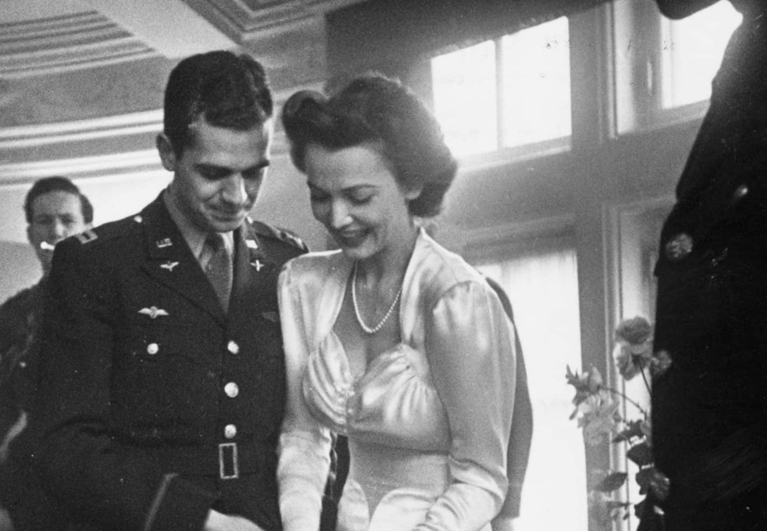 American film actress, Carole Landis (1919 1948) cutting a sultana cake disguised as a wedding cake