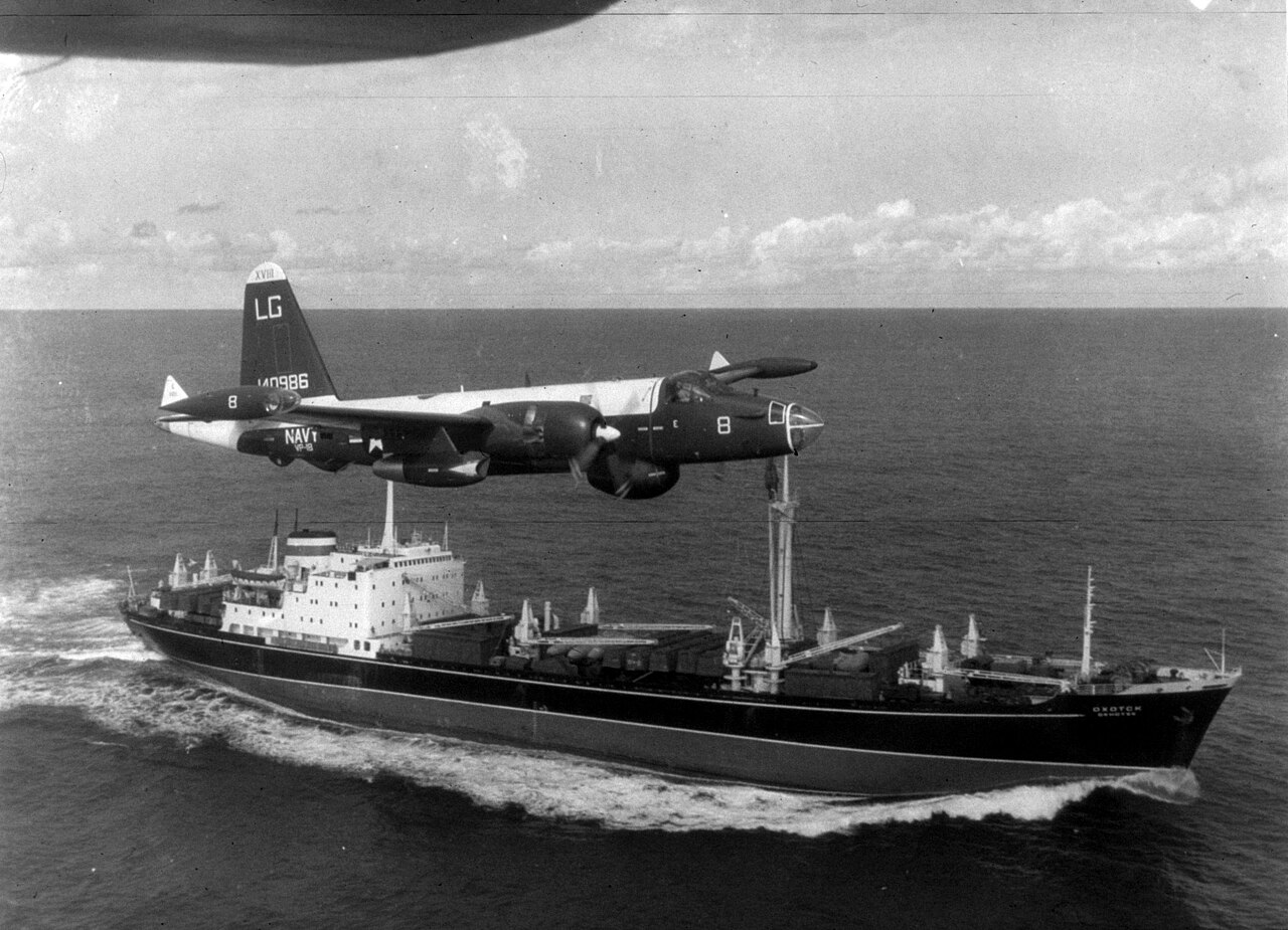 A US Navy P-2H Neptune of VP-18 flying over a Soviet cargo ship
