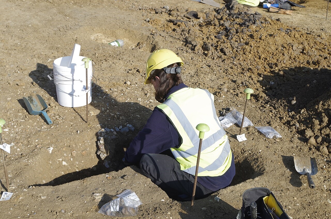 Archaeologist Excavating A Feature At Matthew Arnold School