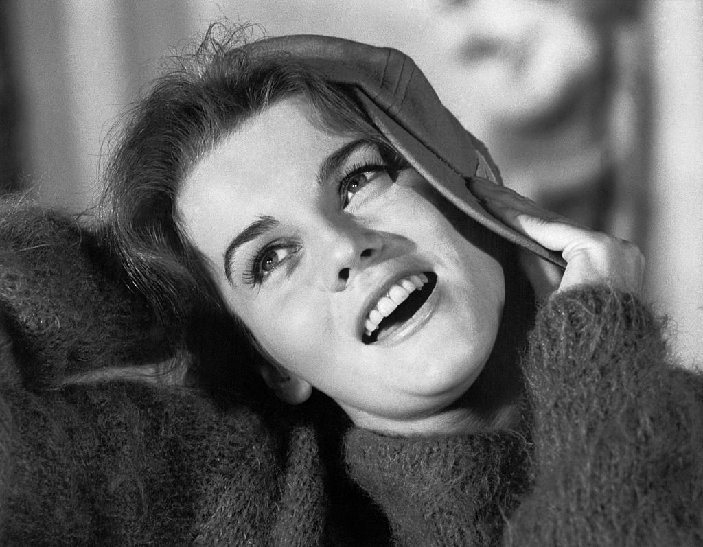 Ann-Margret Holding Cap to Her Head