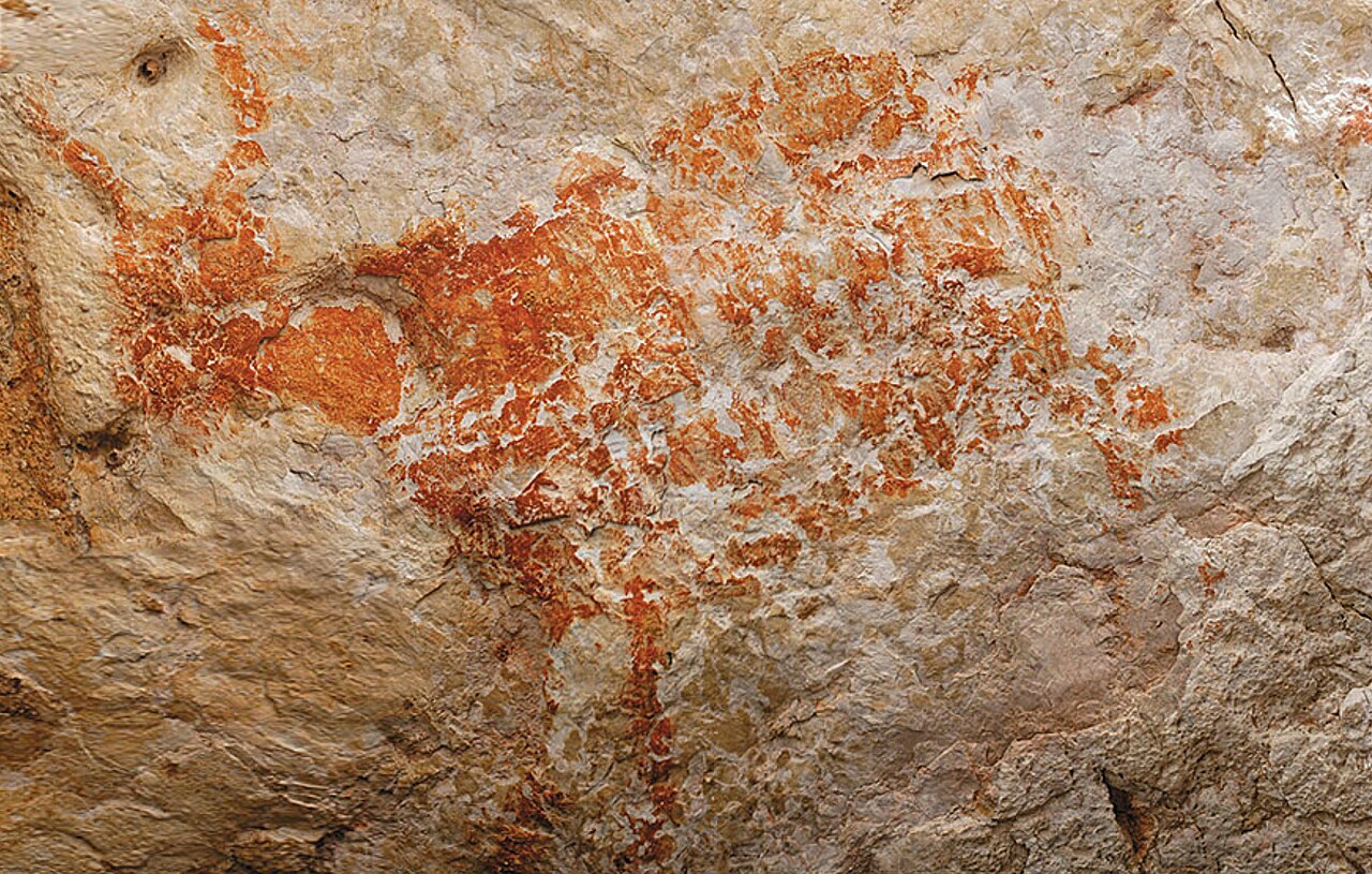 Representation of a wild bovid, the Banteng, made in ochre, discovered in the Lubang Jeriji Saléh cave - 1997