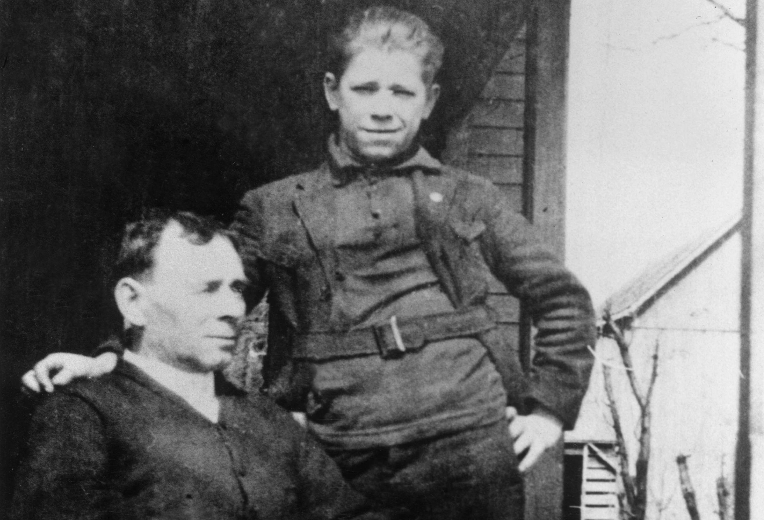 John Dillinger and his father on a farm