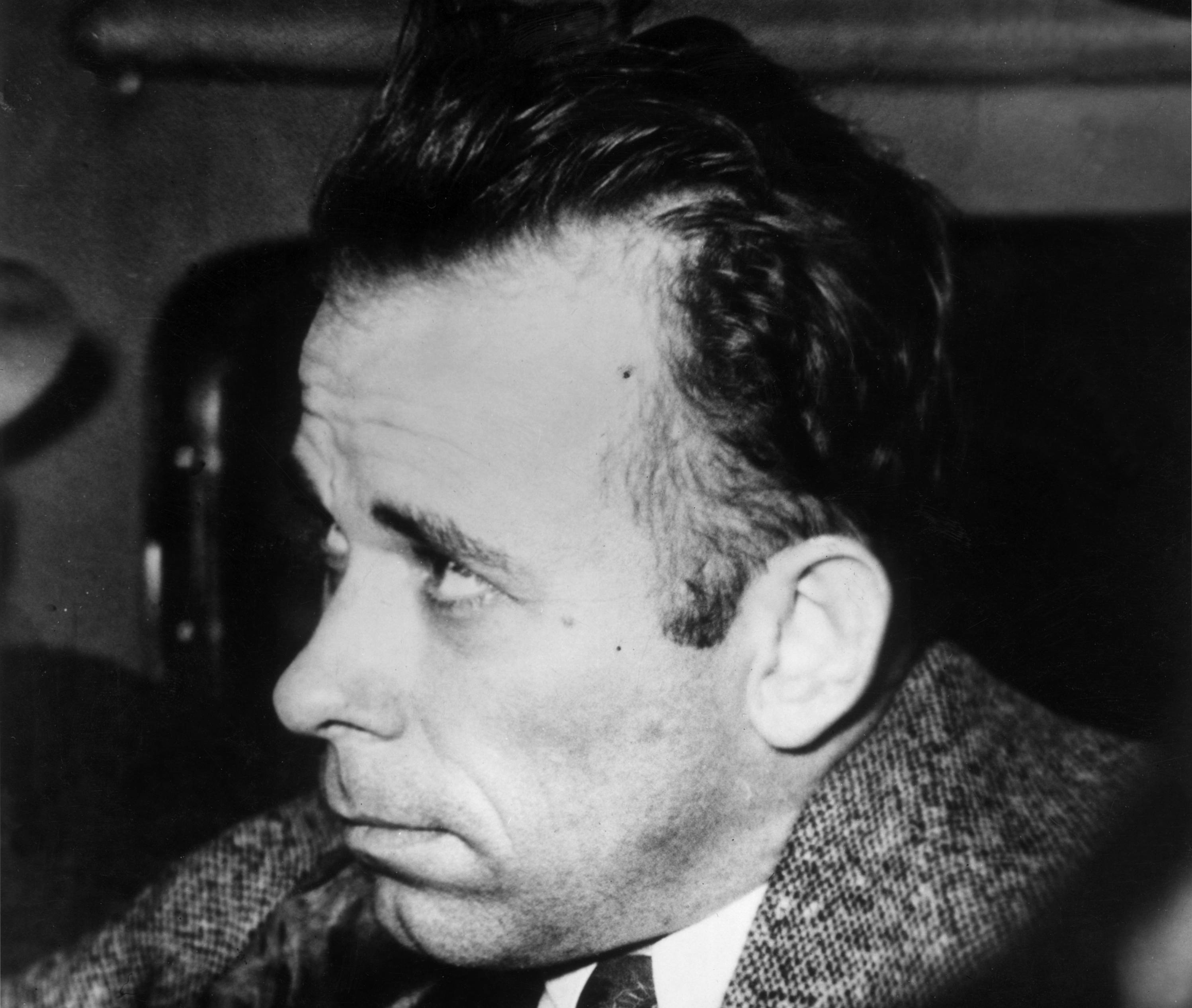 Headshot of American criminal John Dillinger (1902 - 1934) riding in a plane