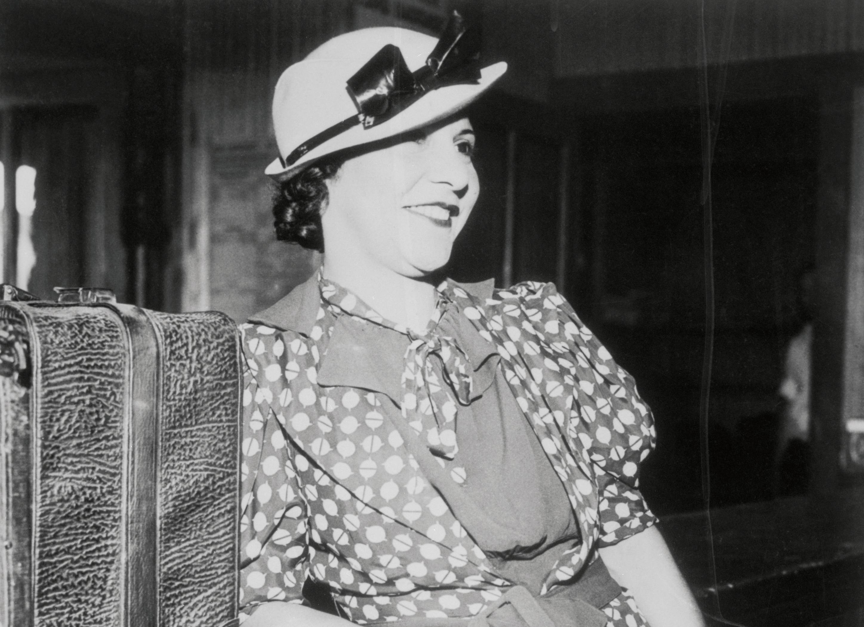 Evelyn Frechette (1907 - 1969), June 1936 next to a suitcase