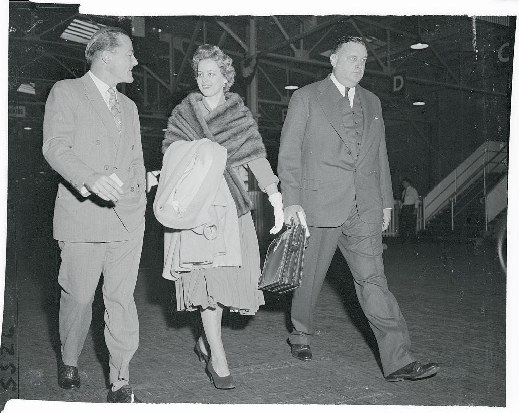 ohn Jacob Astor and his bride, the former Dolores Margaret Fullman, are shown in a picture made on September 21 when they returned to New York aboard the Queen Mary after cutting short a European honeymoon
