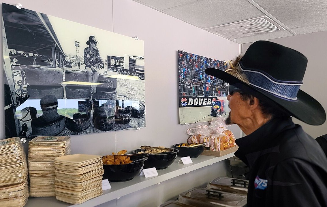 Richard Petty Looks At Photo Of Himself At Dover Speedway 