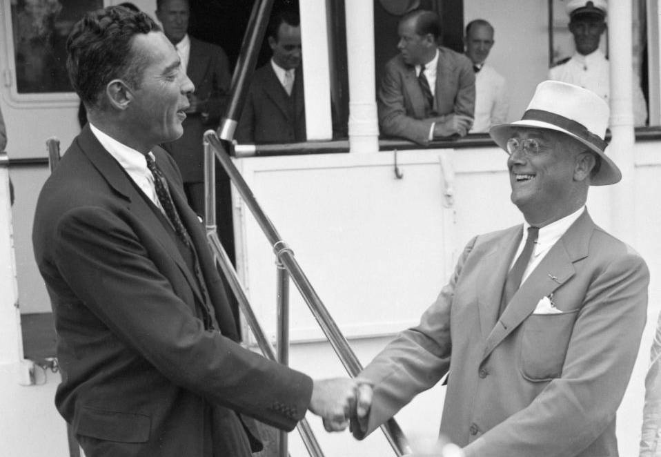 Photo shows Vincent Astor and President Roosevelt shake hands