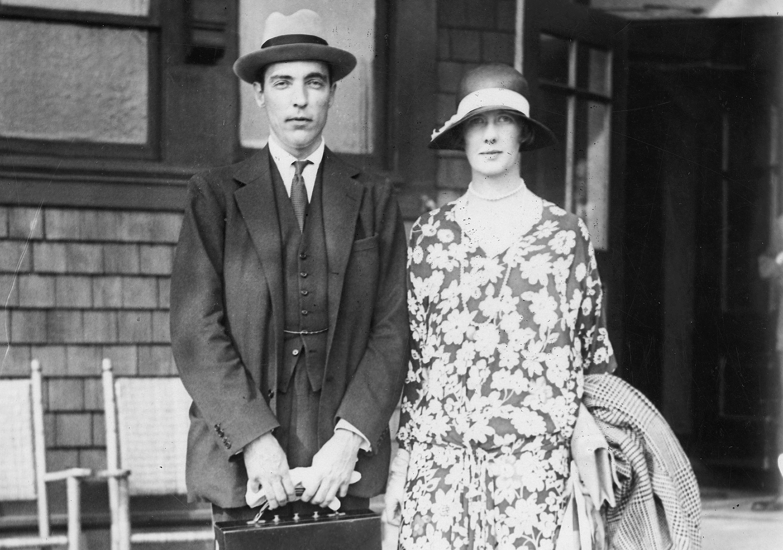 Vincent Astor with his wife, in front of a house