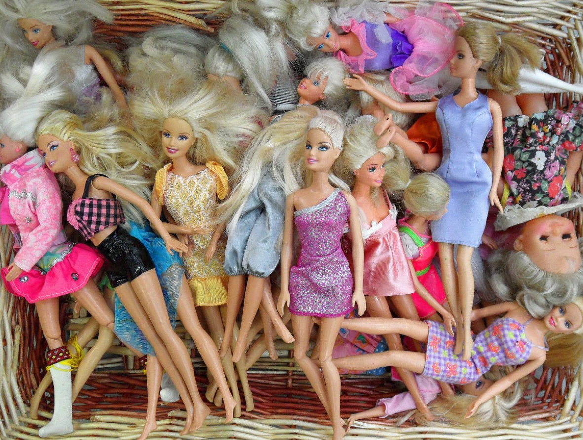 Barbie dolls in a basket