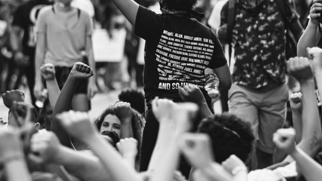 a group of people standing around each other