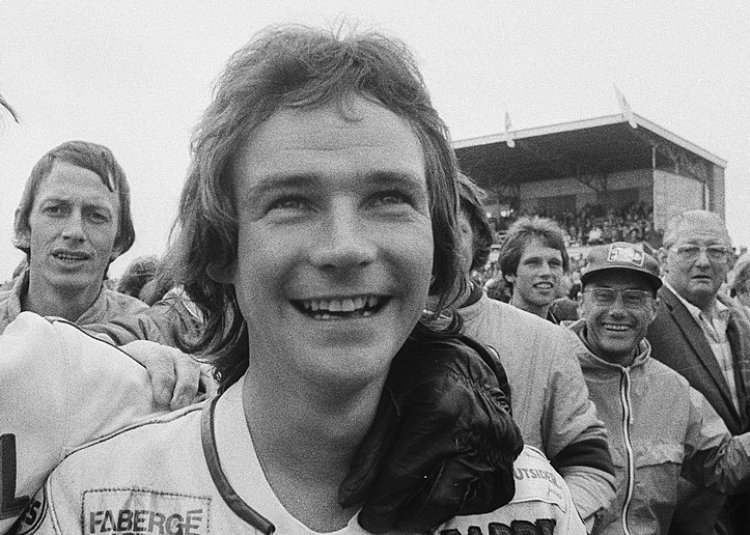 Barry Sheene smiling and looking away from the camera
