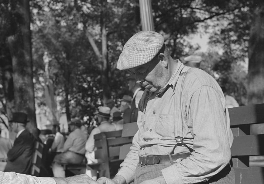 An old photo of a man sitting on a bench, Florida