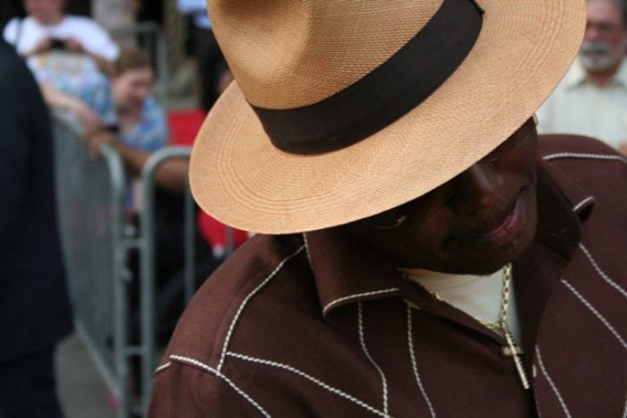 Portrait Photo of in brown outfit and a hat