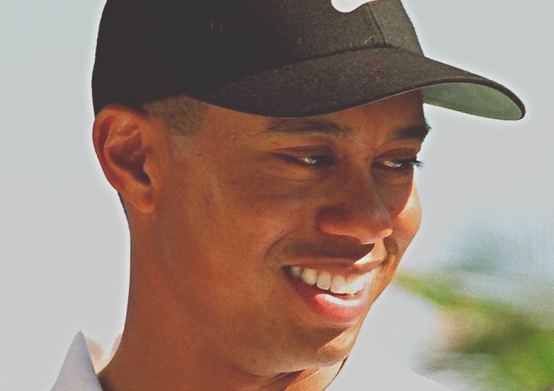 Tiger Woods wearing black cap