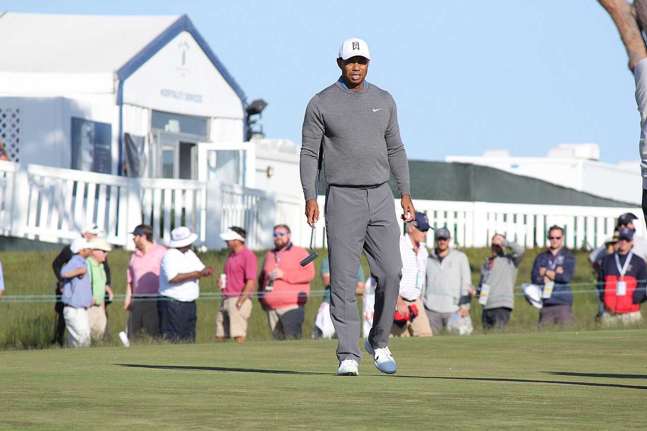 Tiger Woods  wearing grey outfit