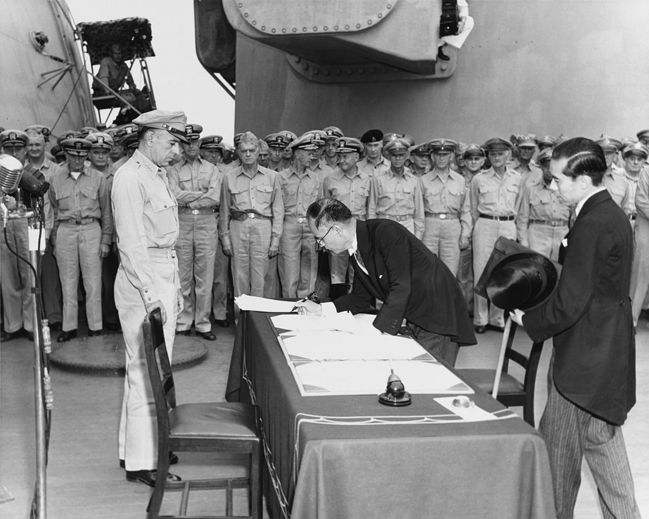 Japanese Foreign Minister Mamoru Shigemitsu signs the Instrument of Surrender