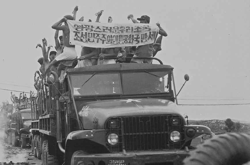 North Korean POWs on US Army trucks during Operation Big Switch