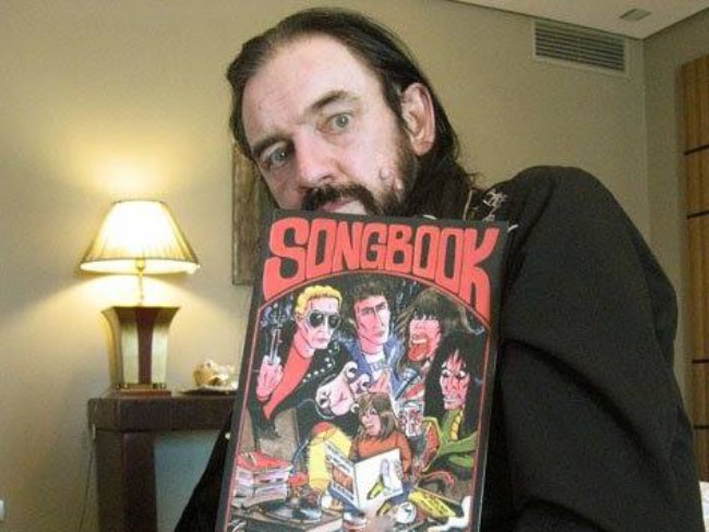 Lemmy posing with a Songbook