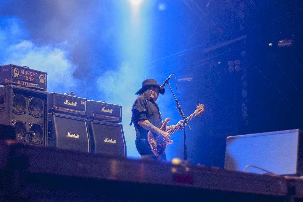 Lemmy Kilmister on stage playing guitar