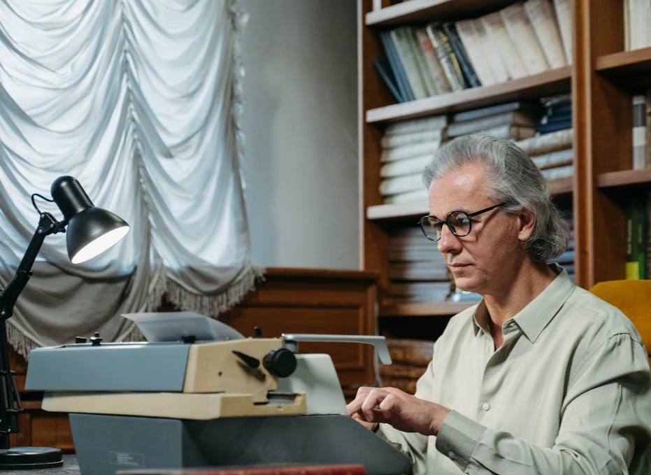 A Man working on his desk.