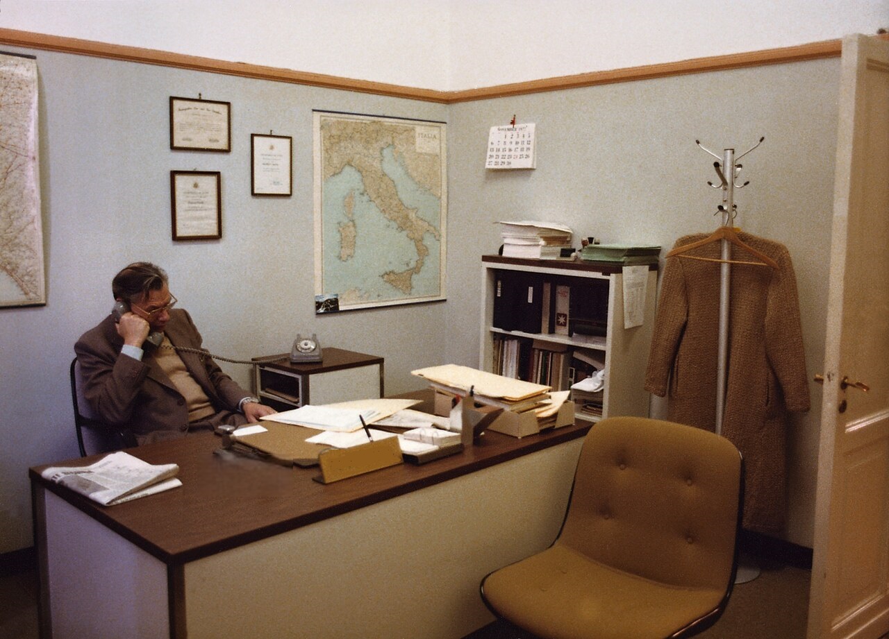 Man in office is talking on telephone - 1977