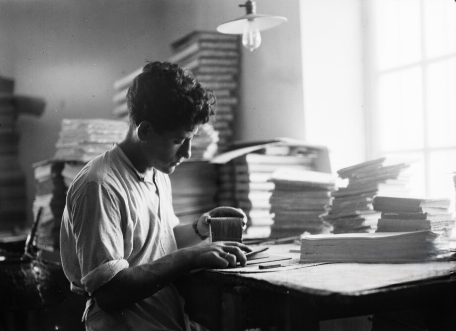 Man Working Behind A Desk.