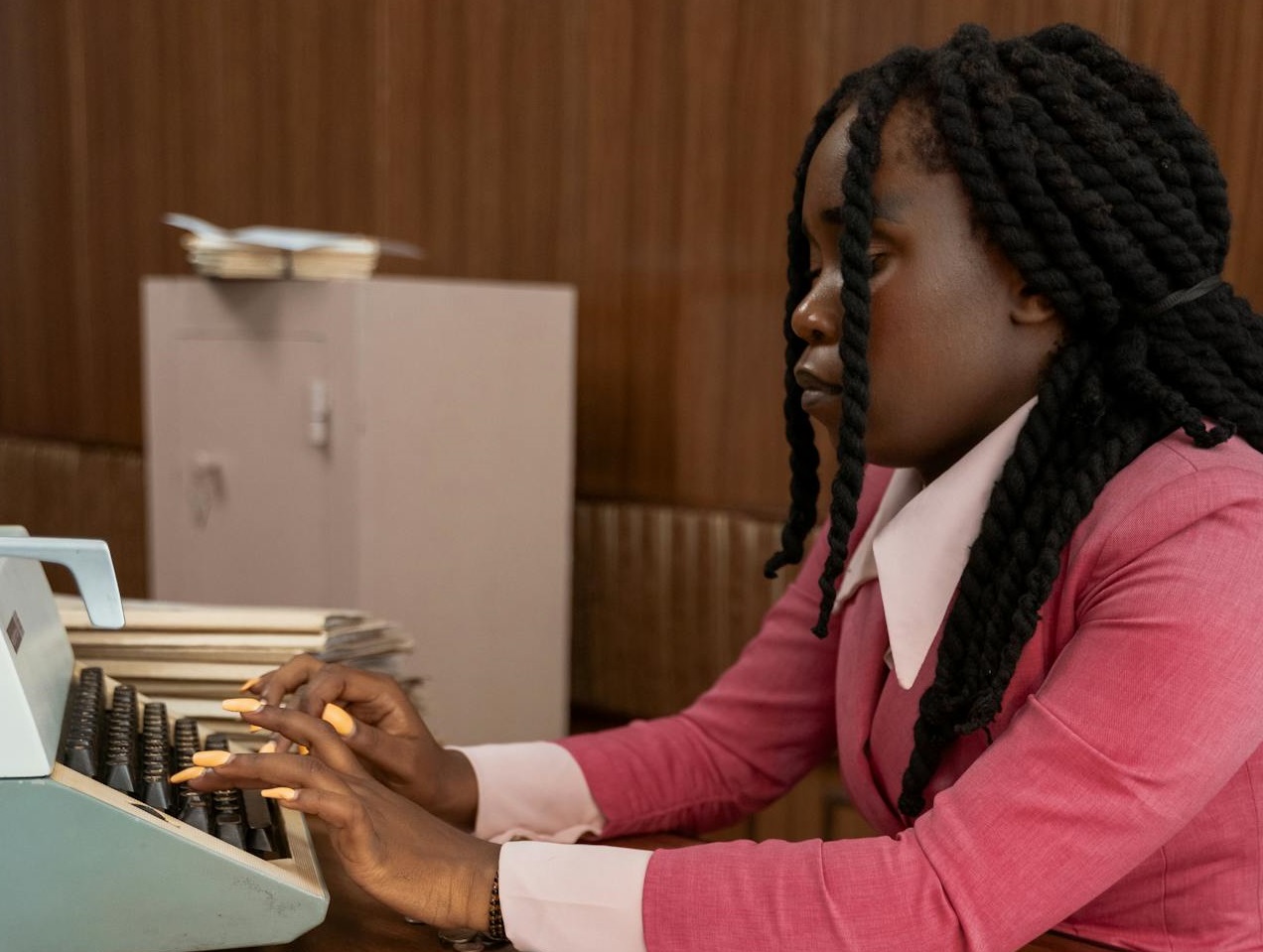 A Woman Using a Typewriter