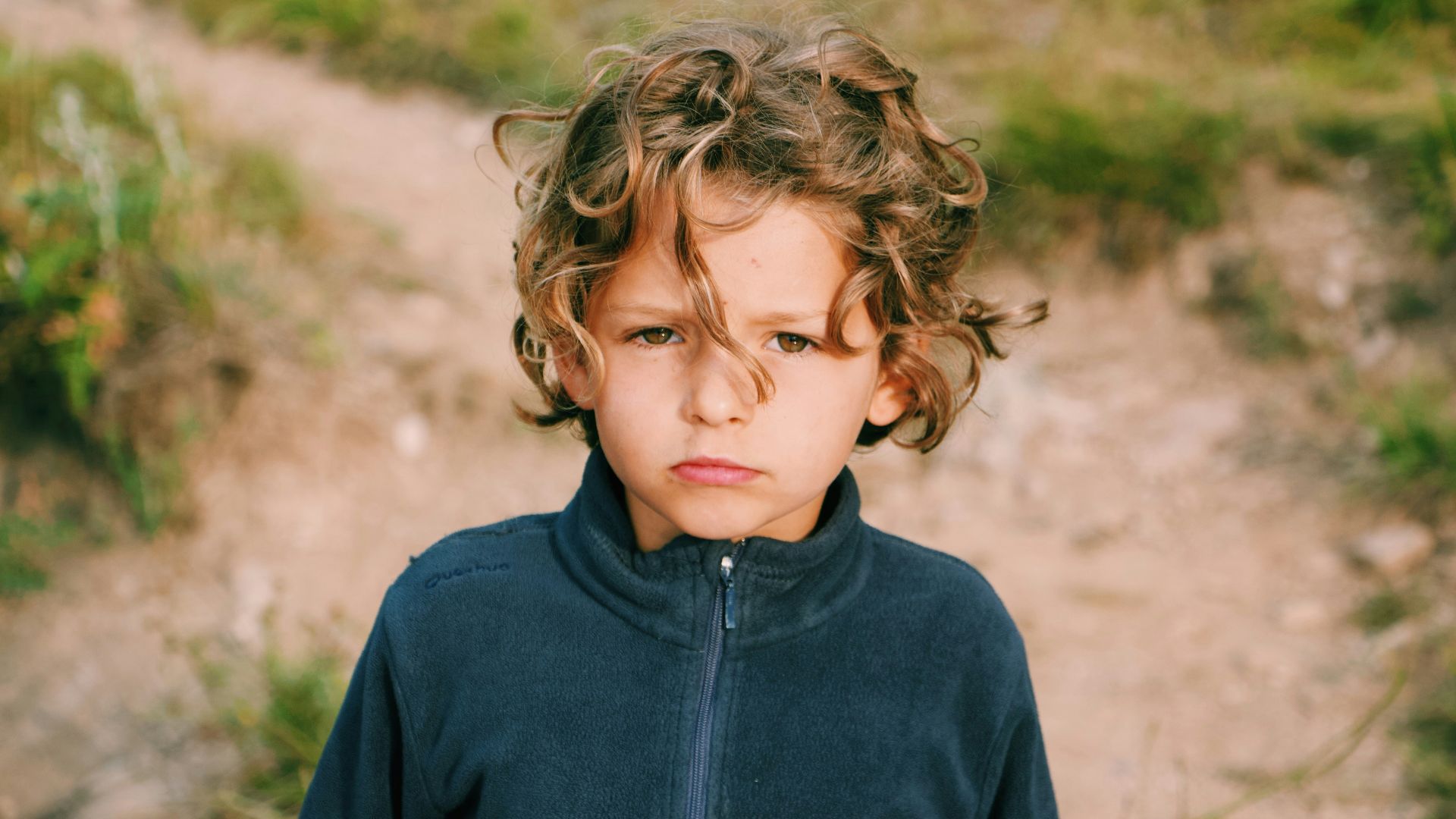 boy wearing zip-up jacket