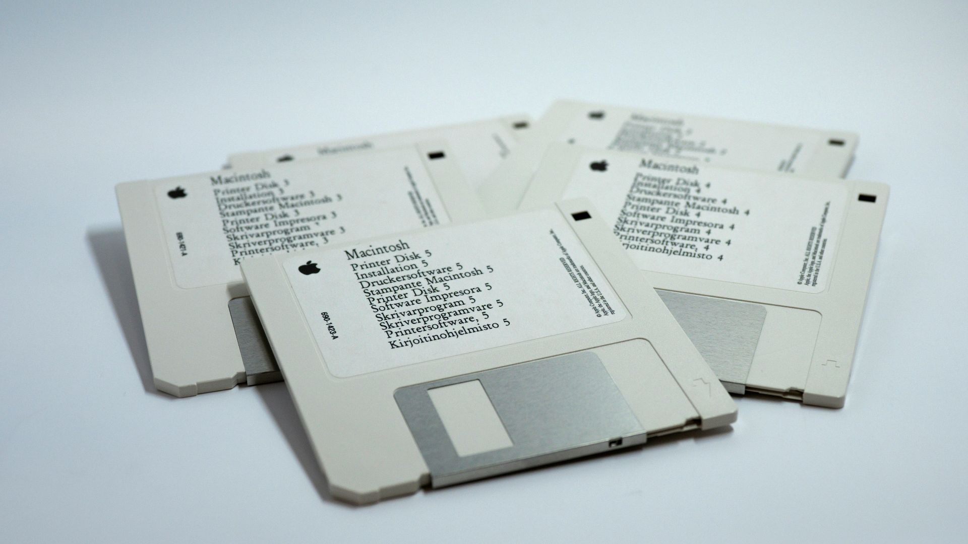 four MacBook diskettes