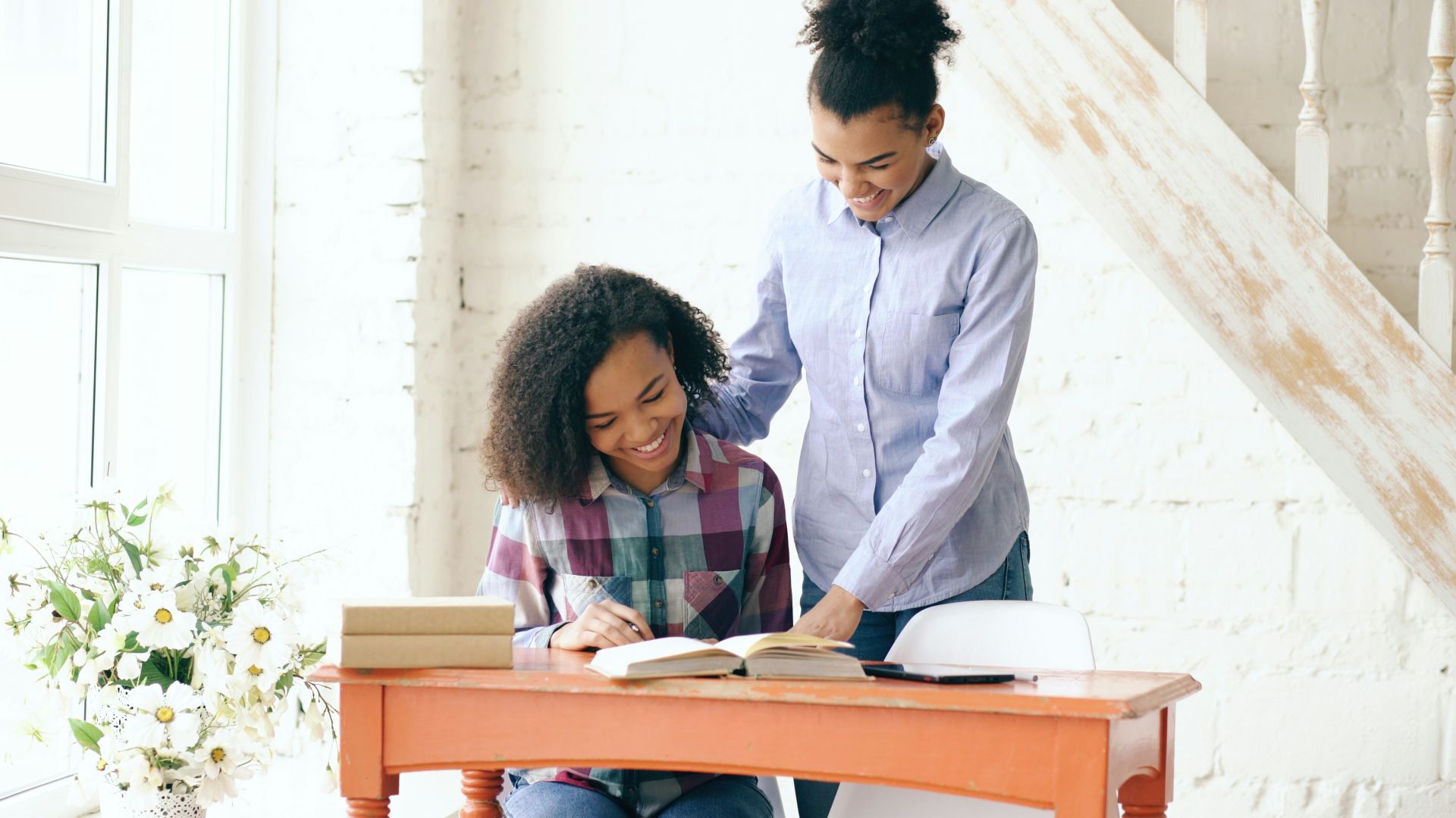 Two women studying at a desk together