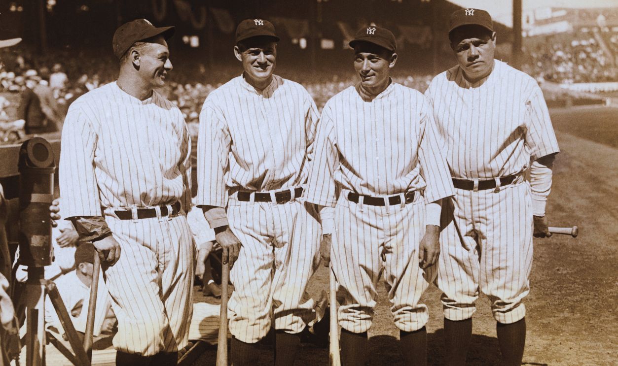 Gettyimages - 530840288, Babe Ruth with Teammates (Original Caption) The Four Big Hitters Of The Yankees. New York City: Left to right: Lou Gehrig, 1st base; Earl Combs, center field; Tony Lazzeri, 3rd base; and the one and only Babe Ruth, right field; in front of their dugout before their first game of the 1931 season against the Boston Red Sox at Yankee Stadium here.