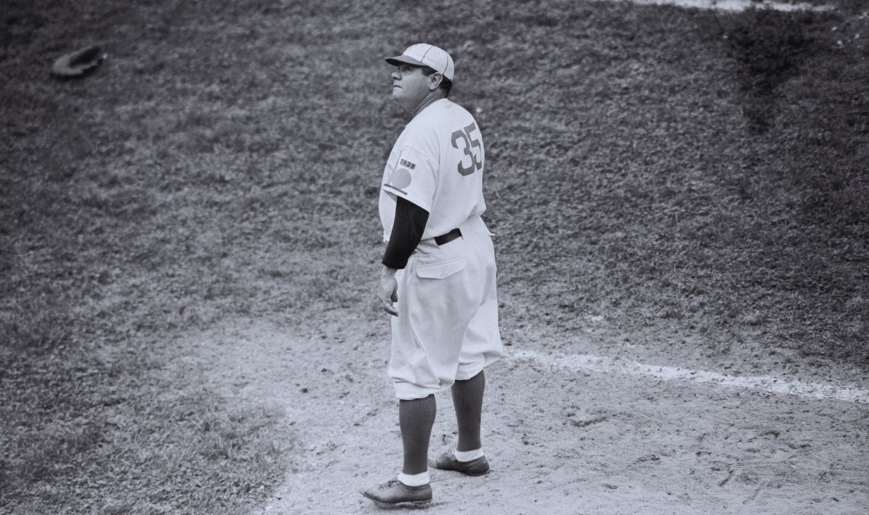 Gettyimages - 515171056, Babe Ruth Pausing on the Field (Original Caption) New York City: Babe Ruth Returns To The Old Ball Game. Babe Ruth, back in baseball uniform for the first time, since June 1935, watches a high one from the coach's box at Ebbets Field, Brooklyn, June 19th, as he makes his debut as coach for the Brooklyn Dodgers in their double header with the Chicago Cubs.
