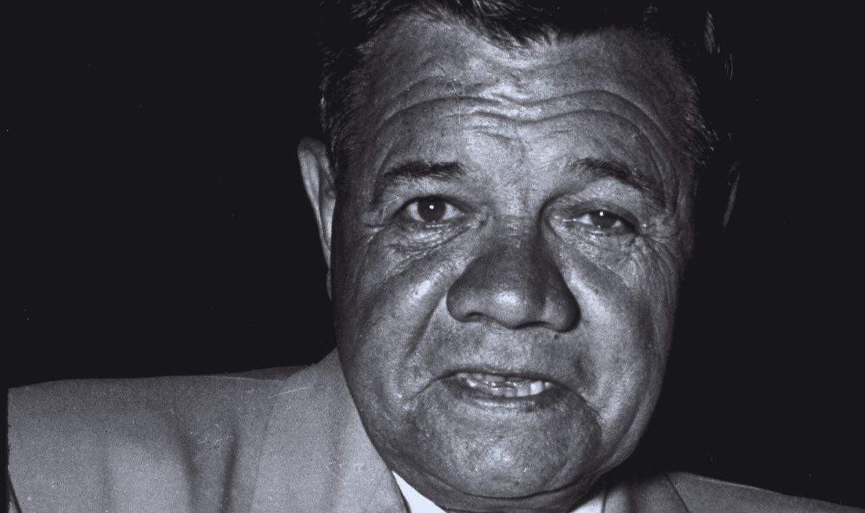 Gettyimages - 50714561, Babe Ruth Baseball star Babe Ruth signing an autograph on a baseball.