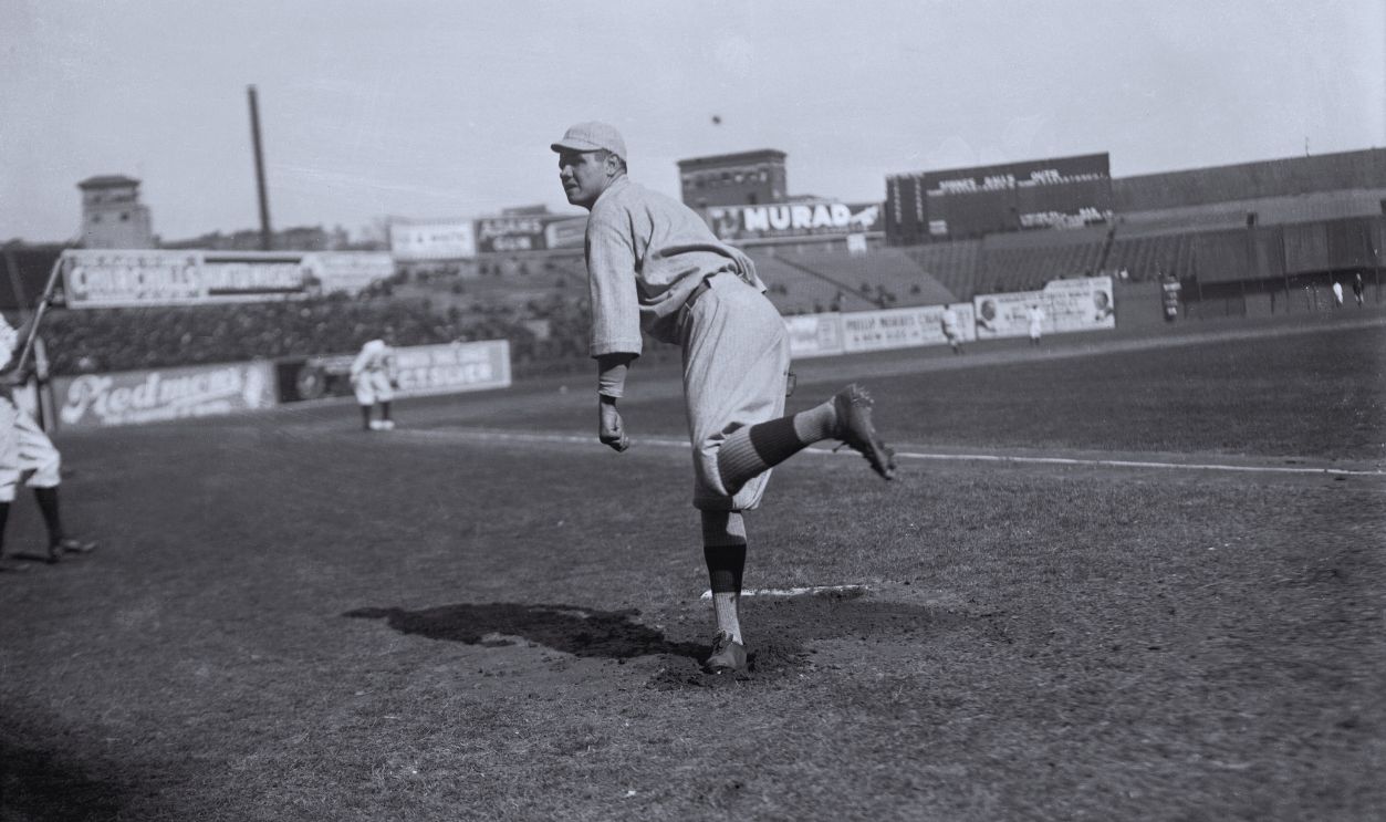 Gettyimages - 515174548, Babe Ruth in Pitching Stance Babe Ruth, Boston Red Sox pitcher on the field.