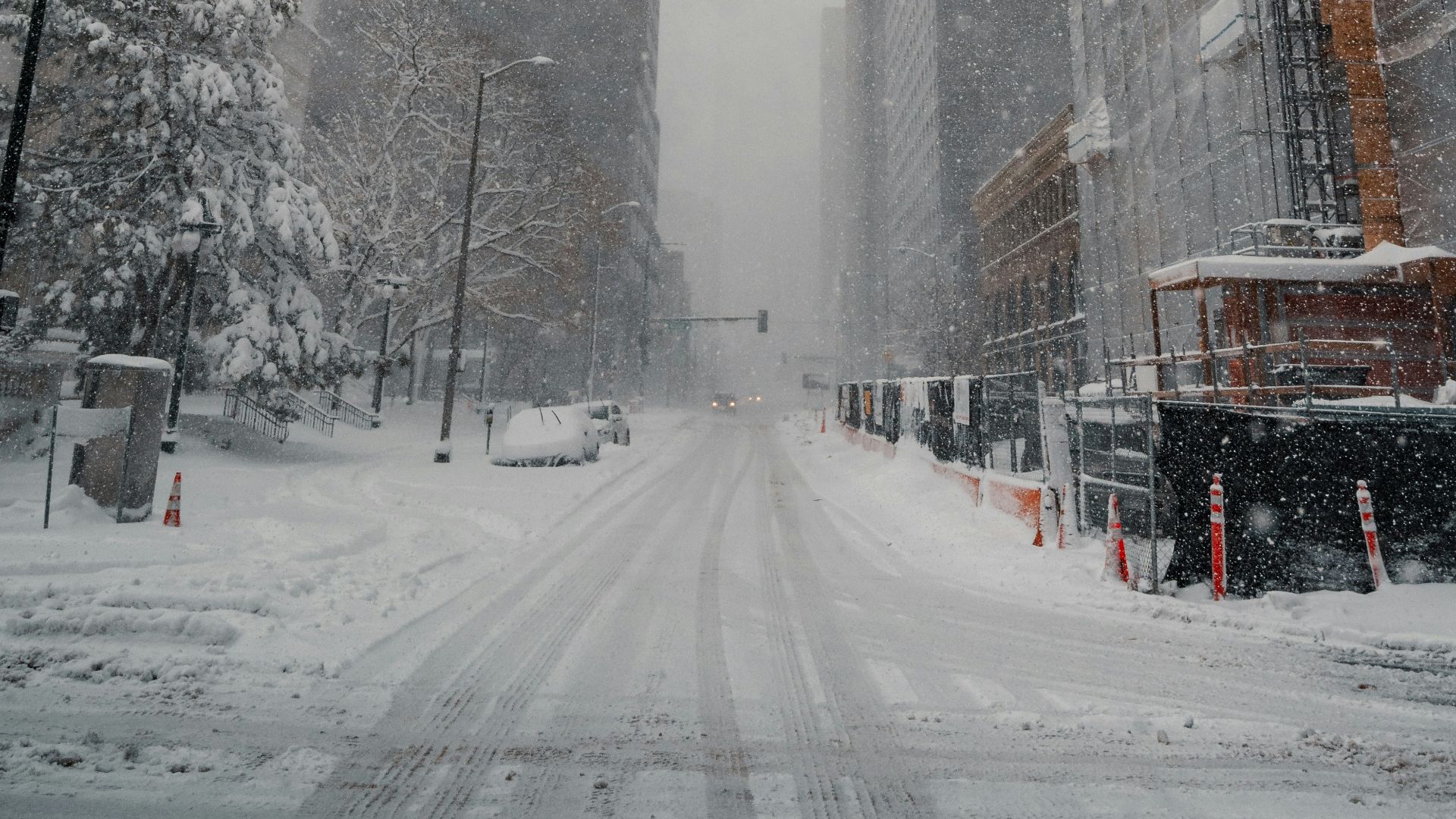 snow covered road near building during daytime