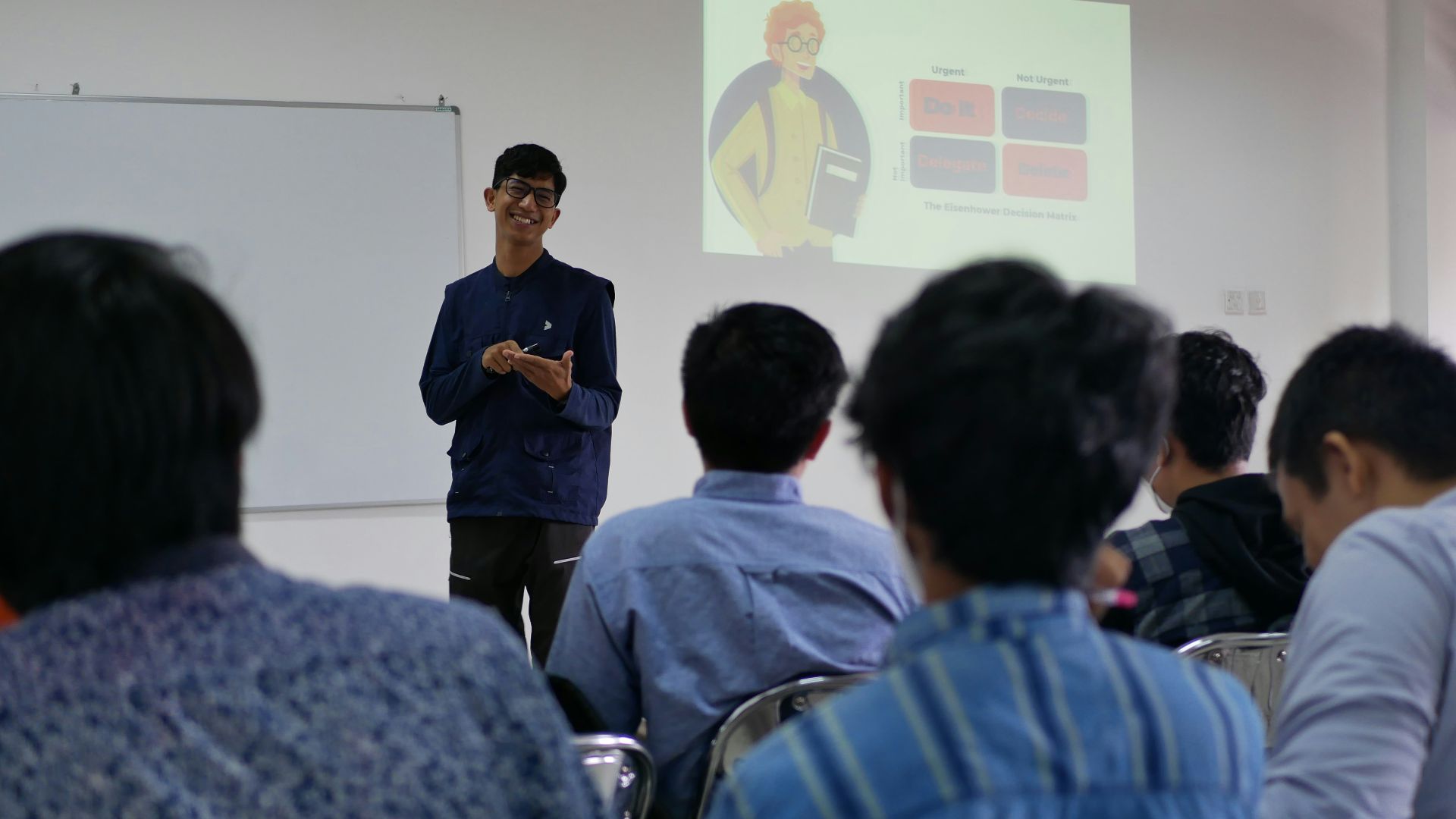 a man standing in front of a group of people