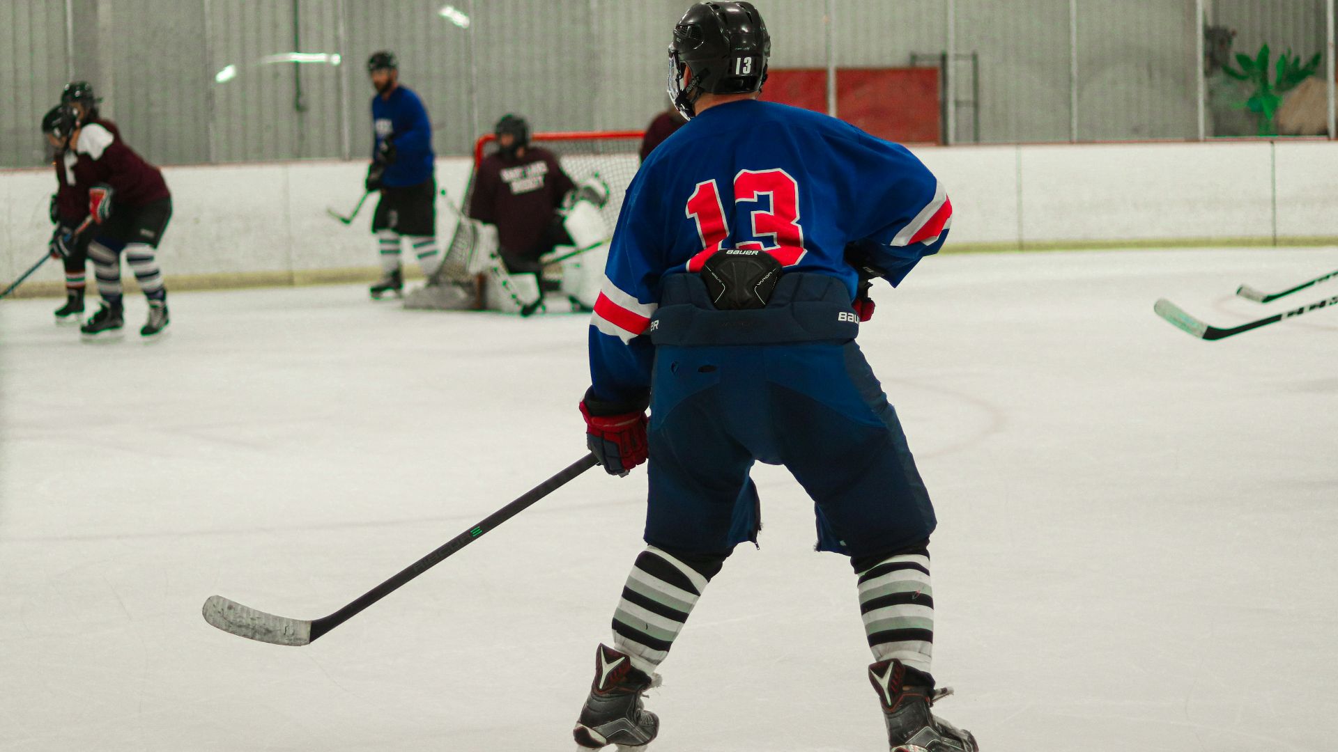 ice hockey players on ice hockey field