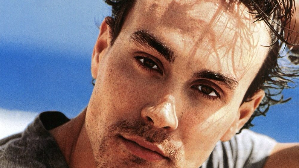 Portrait Photo of the Actor Brandon Lee in a gray t-shirt