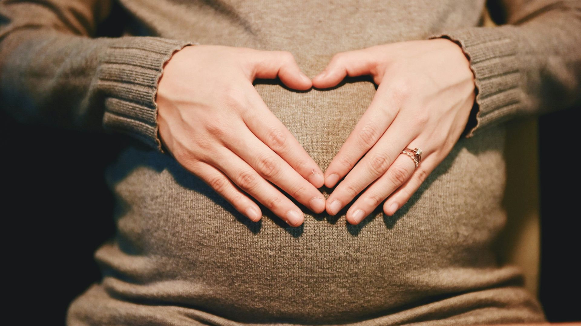 person holding belly photo