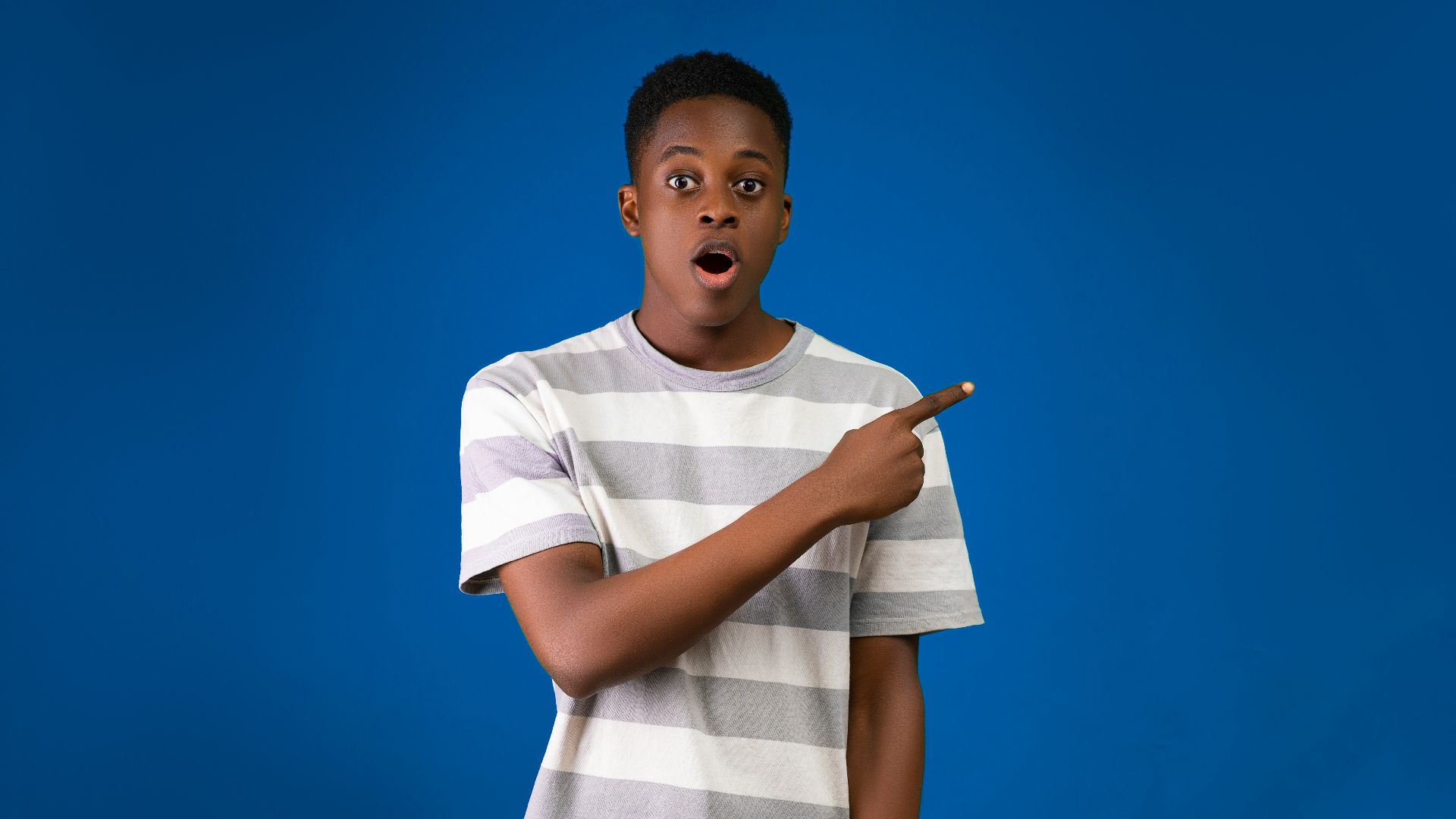 a boy holding a stick